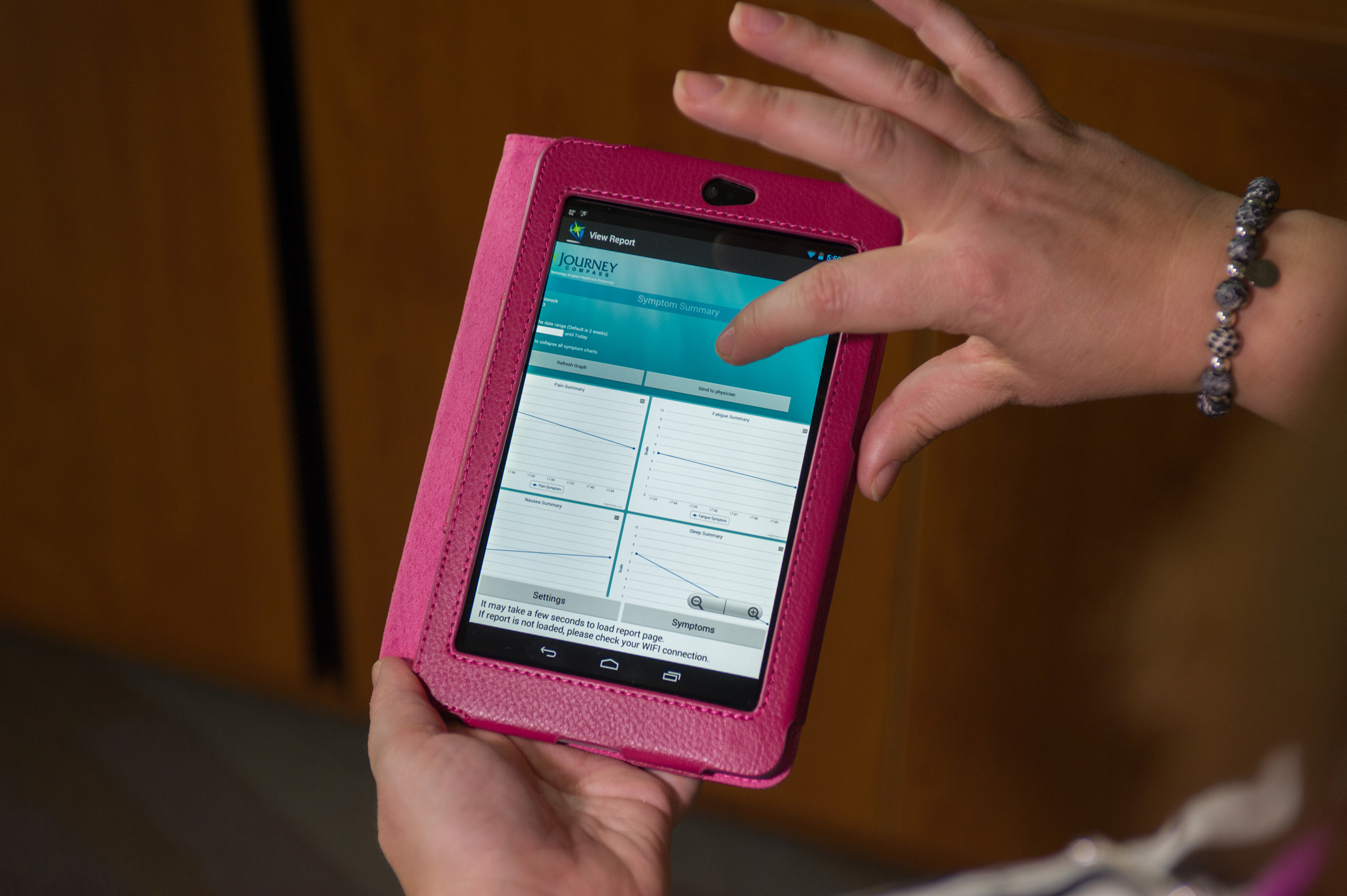 A Nexus 7 tablet computer is provided to patients through the MyJourney Compass pilot project. The computer provides medical information, access to health information records and a symptom tracker for regular communication with physicians. The screen shown is the symptom tracker. (Georgia Tech Photo: Rob Felt)